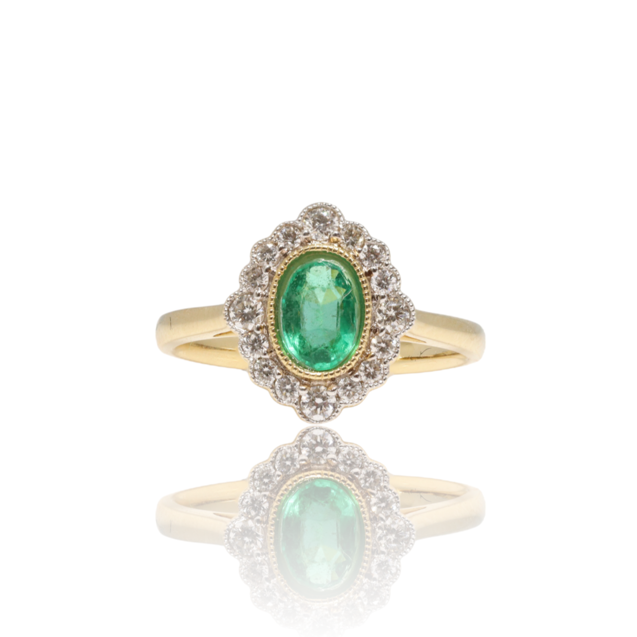 18 CT YELLOW GOLD EMERALD AND DIAMOND RING