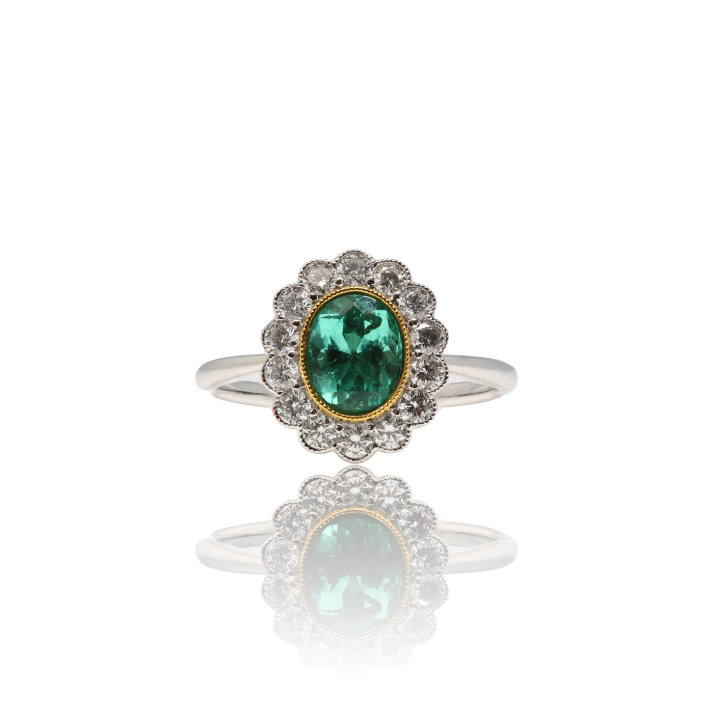 18CT WHITE GOLD EMERALD AND DIAMOND RING