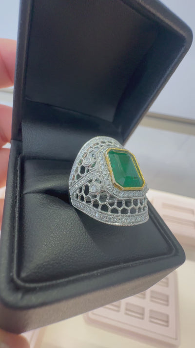 PLATINUM EMERALD AND DIAMOND DRESS RING