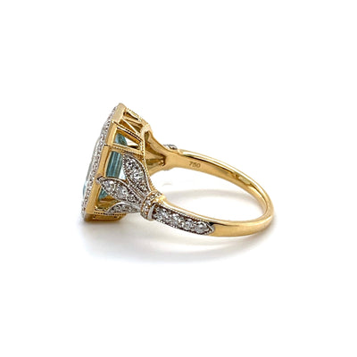 18CT YELLOW GOLD AQUAMARINE AND DIAMOND RING