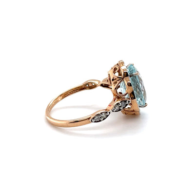 18CT ROSE GOLD AQUAMARINE AND DIAMOND RING