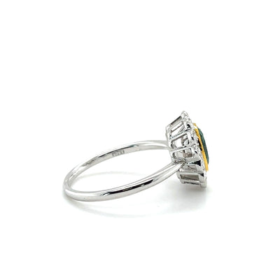 18CT WHITE GOLD EMERALD AND DIAMOND RING