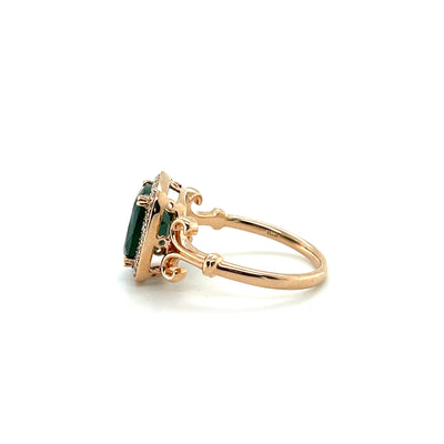 18CT ROSE GOLD EMERALD AND DIAMOND RING