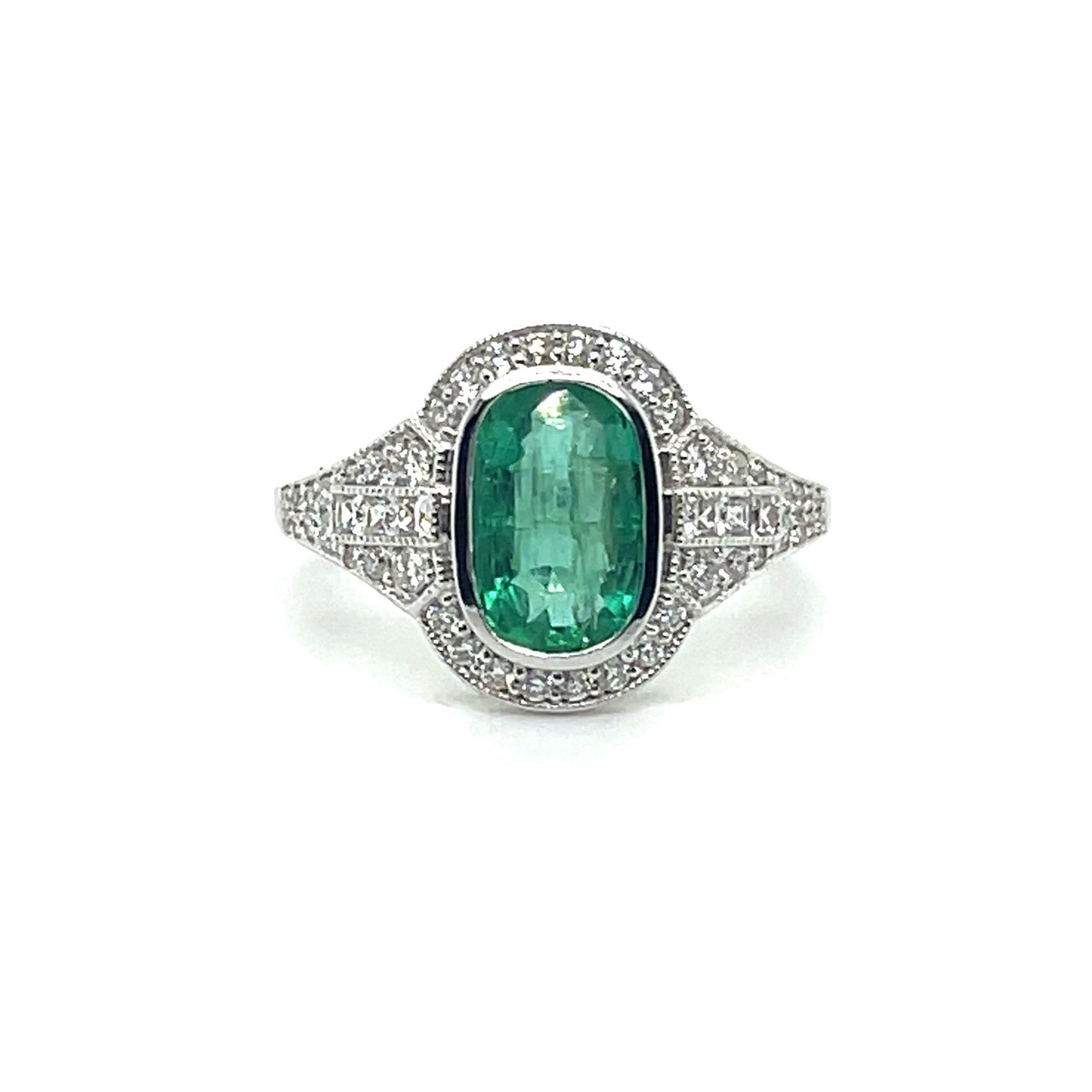 18CT WHITE GOLD EMERALD AND DIAMOND RING