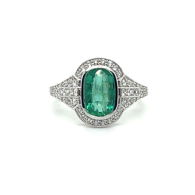 18CT WHITE GOLD EMERALD AND DIAMOND RING