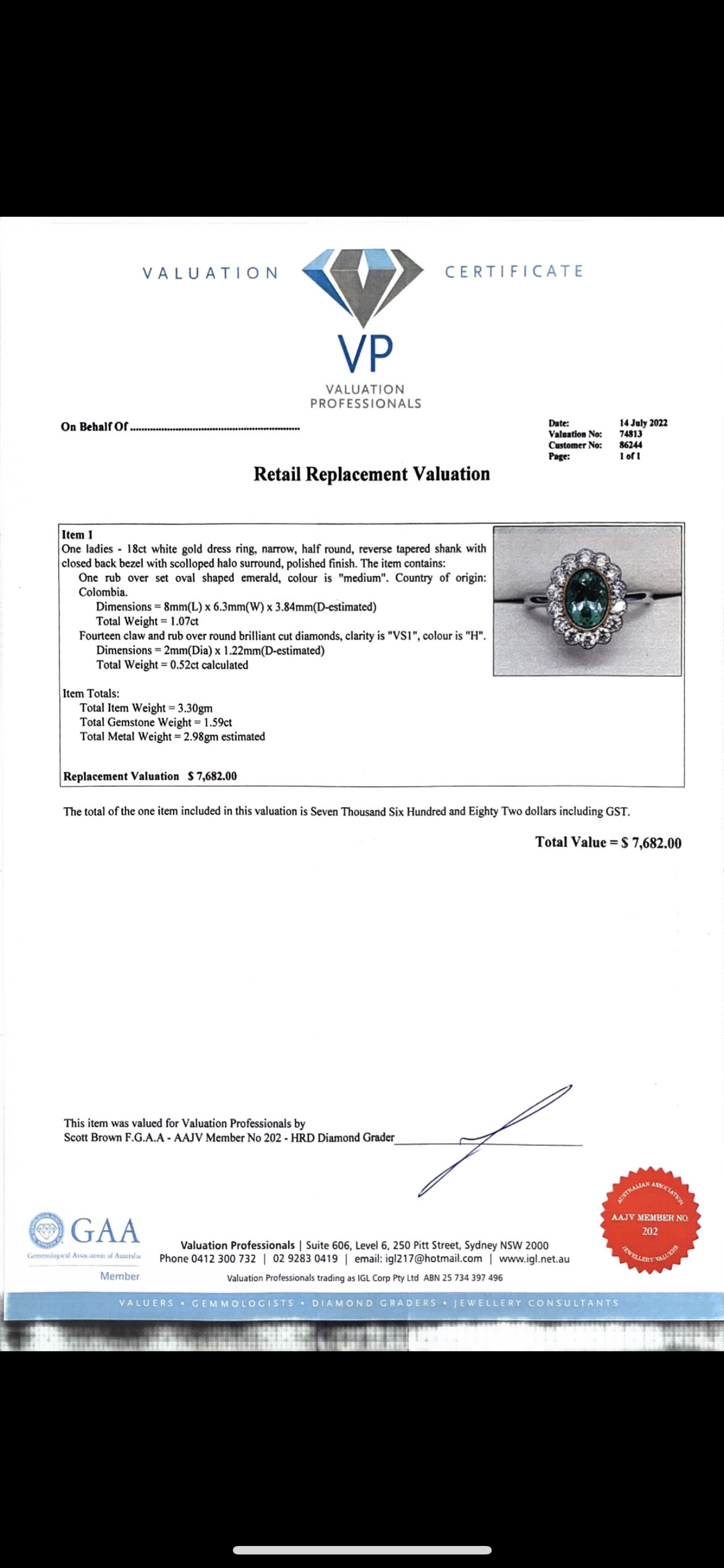 18CT WHITE GOLD EMERALD AND DIAMOND RING